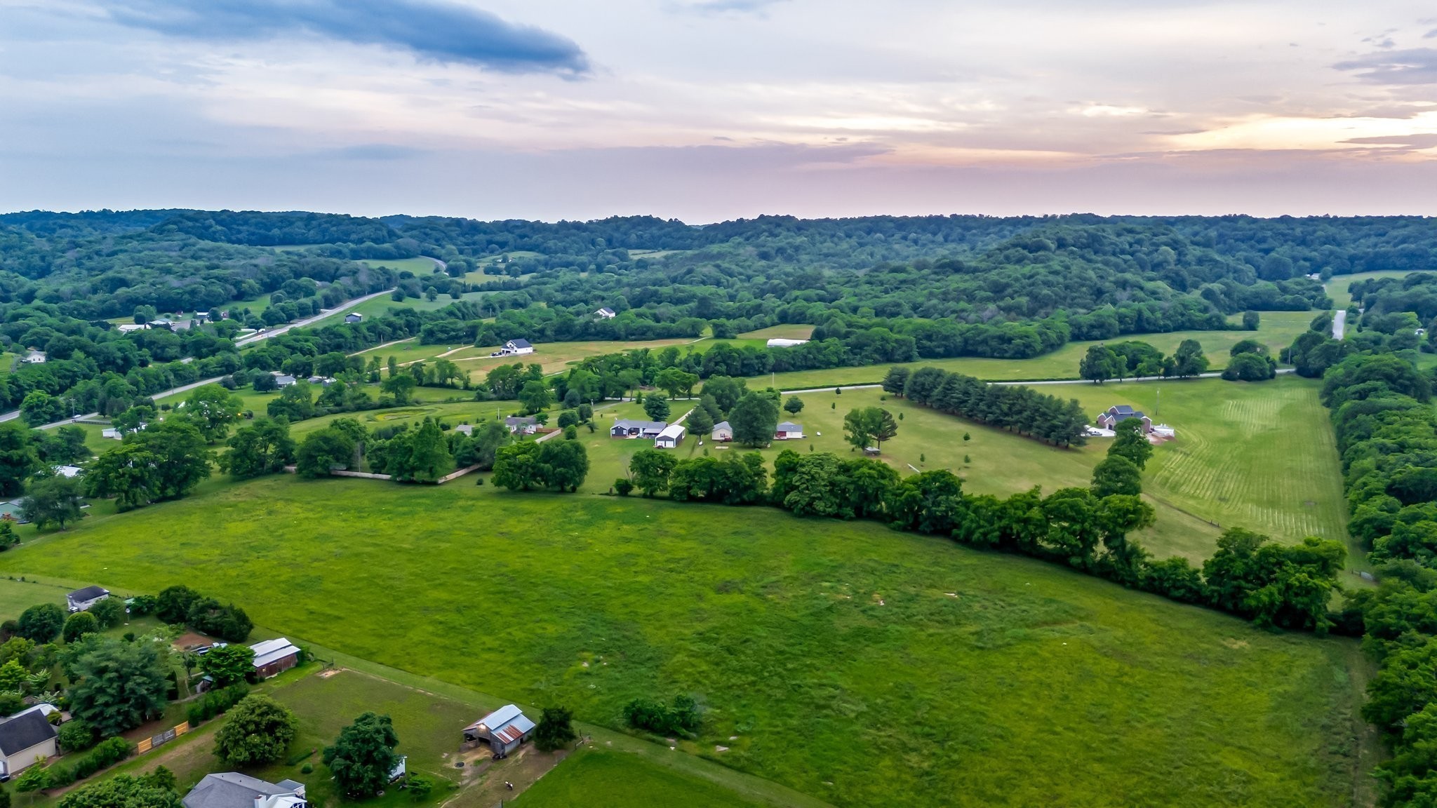 3310 Booker Ridge Road Mount Pleasant, TN 38474 - Photo 39 of 40 an aerial view of residential houses with outdoor space and trees