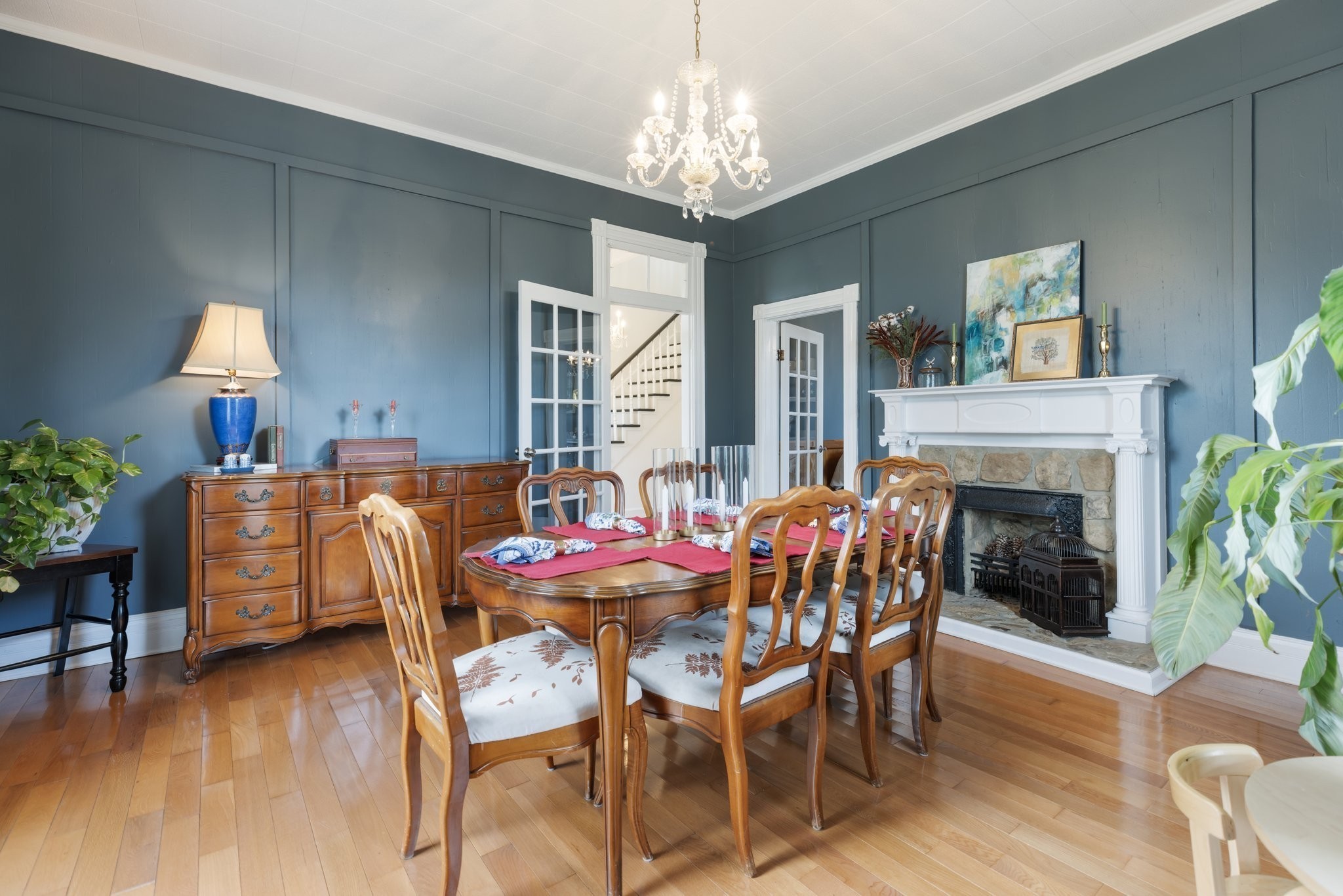 3310 Booker Ridge Road Mount Pleasant, TN 38474 - Photo 6 of 40 a dining room with furniture a chandelier and wooden floor