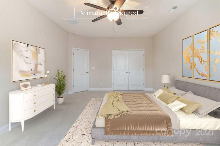 2263 Eversham Drive Northwest Concord, NC 28027 - Photo 3 of 21 a bedroom with a bed and a window