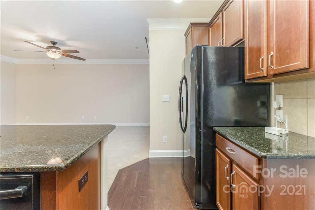 2263 Eversham Drive Northwest Concord, NC 28027 - Photo 10 of 21 a kitchen with stainless steel appliances granite countertop a refrigerator a sink and dishwasher