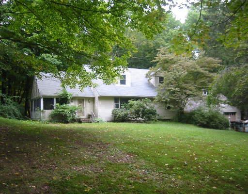 58 Codfish Hill Road Bethel, CT 06801 - Photo 1 of 1 a front view of a house with a garden