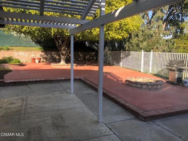 a view of a backyard with a patio