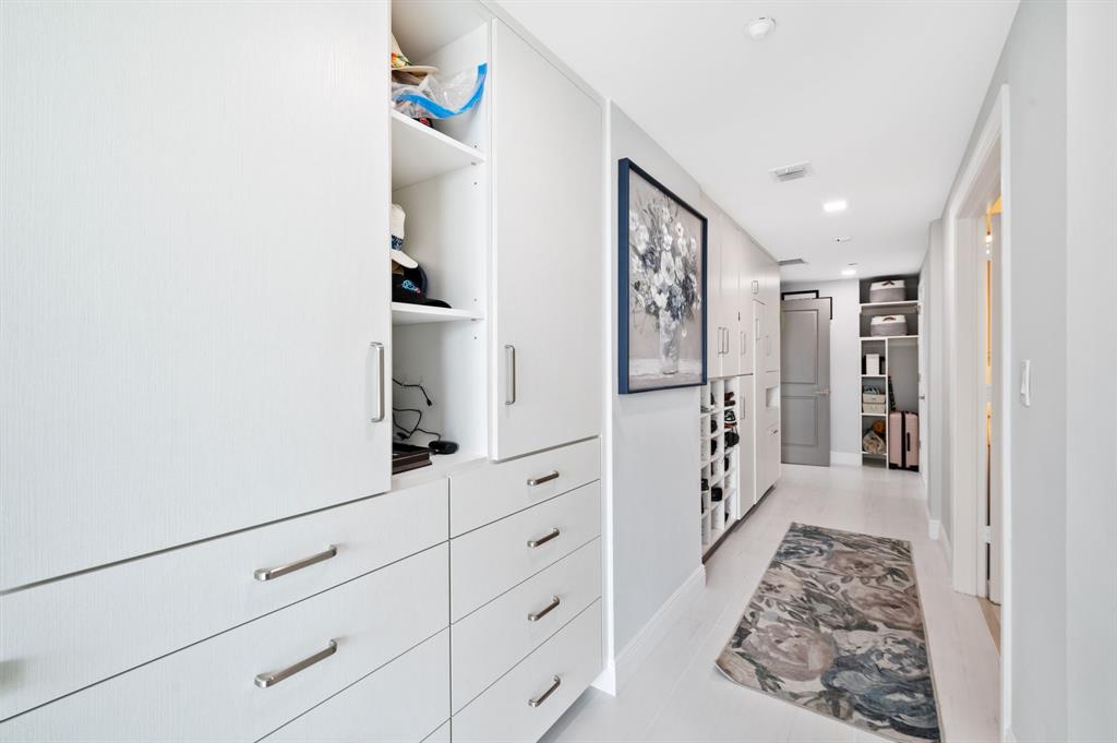 400 Hendricks Isle, Unit 3A Fort Lauderdale, FL 33301 - Photo 23 of 37 a hallway with white cabinets and window