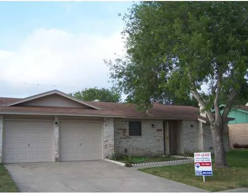 a house with trees in the background