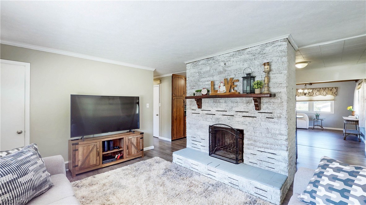 3659 Morrow Road Kent, OH 44240 - Photo 9 of 39 Painted brick fireplace with a wood mantel