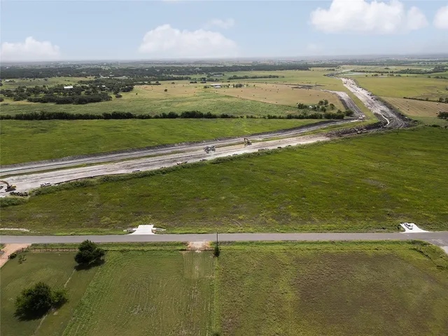 a view of an ocean and a houses