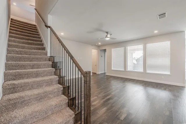 a view of an entryway with wooden floor