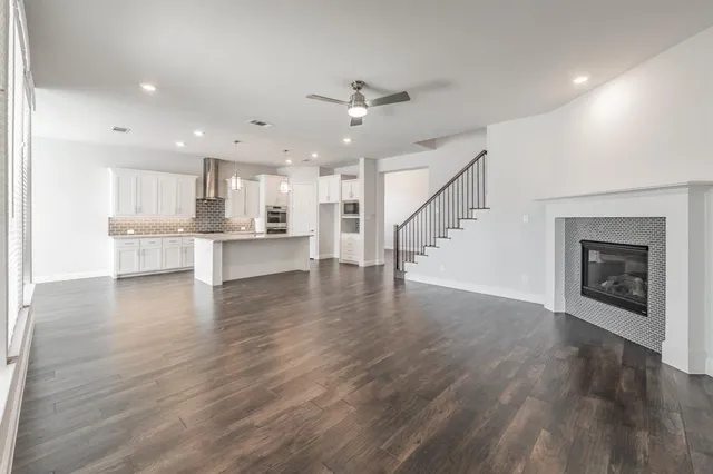a view of kitchen with cabinets and wooden floor