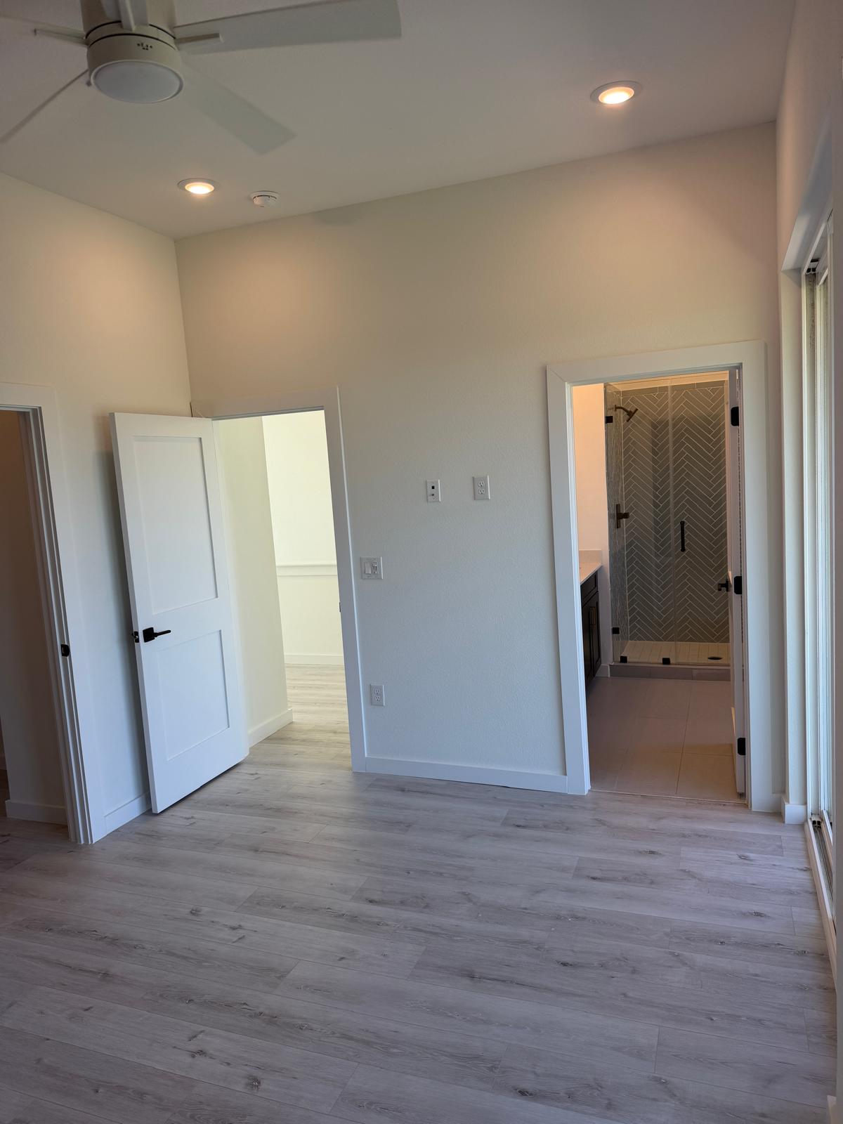 2000 Riverside Farms Road, Unit 12101 Austin, TX 78741 - Photo 19 of 33 Smooth wood-look flooring and recessed lighting define this versatile room with an attached bath.