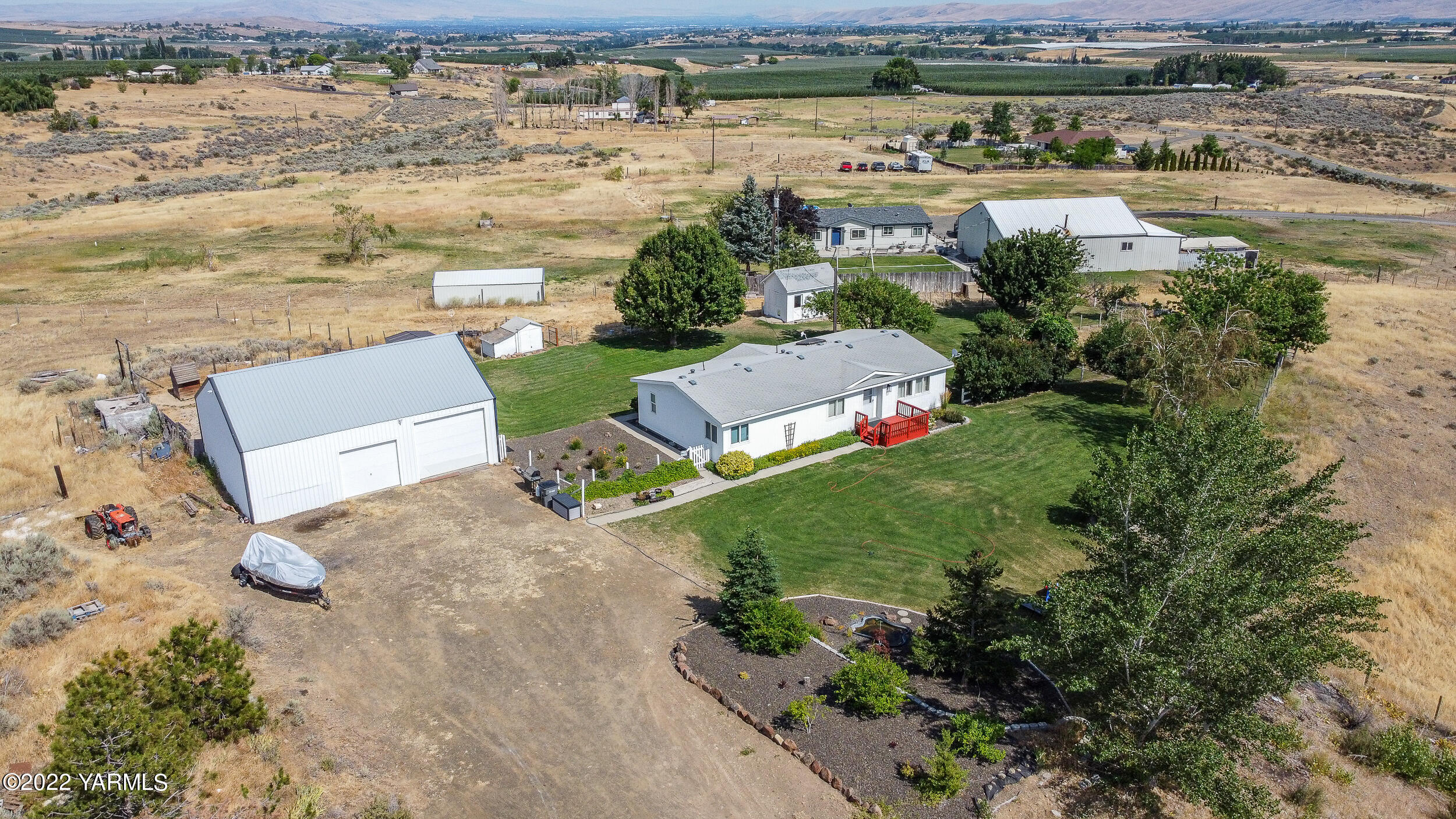 341 Winchester Road Yakima, WA 98908 - Photo 1 of 38 an aerial view of a house with a lake view