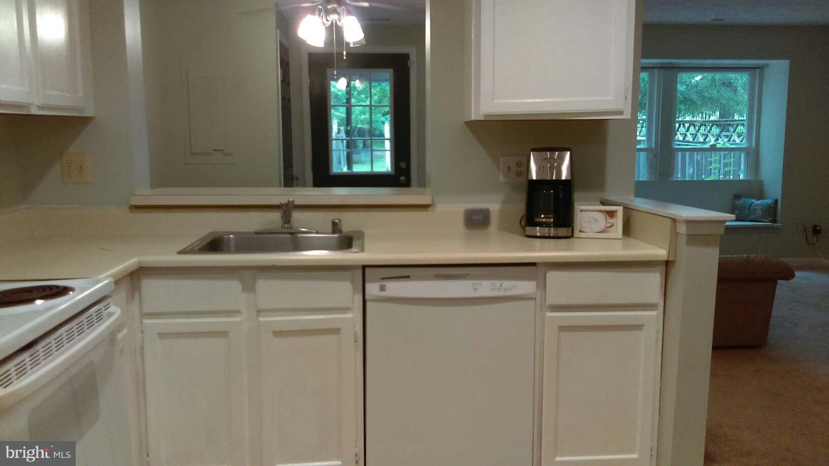 14116 Aldora Circle Silver Spring, MD 20904 - Photo 15 of 30 a kitchen with cabinets appliances and a sink