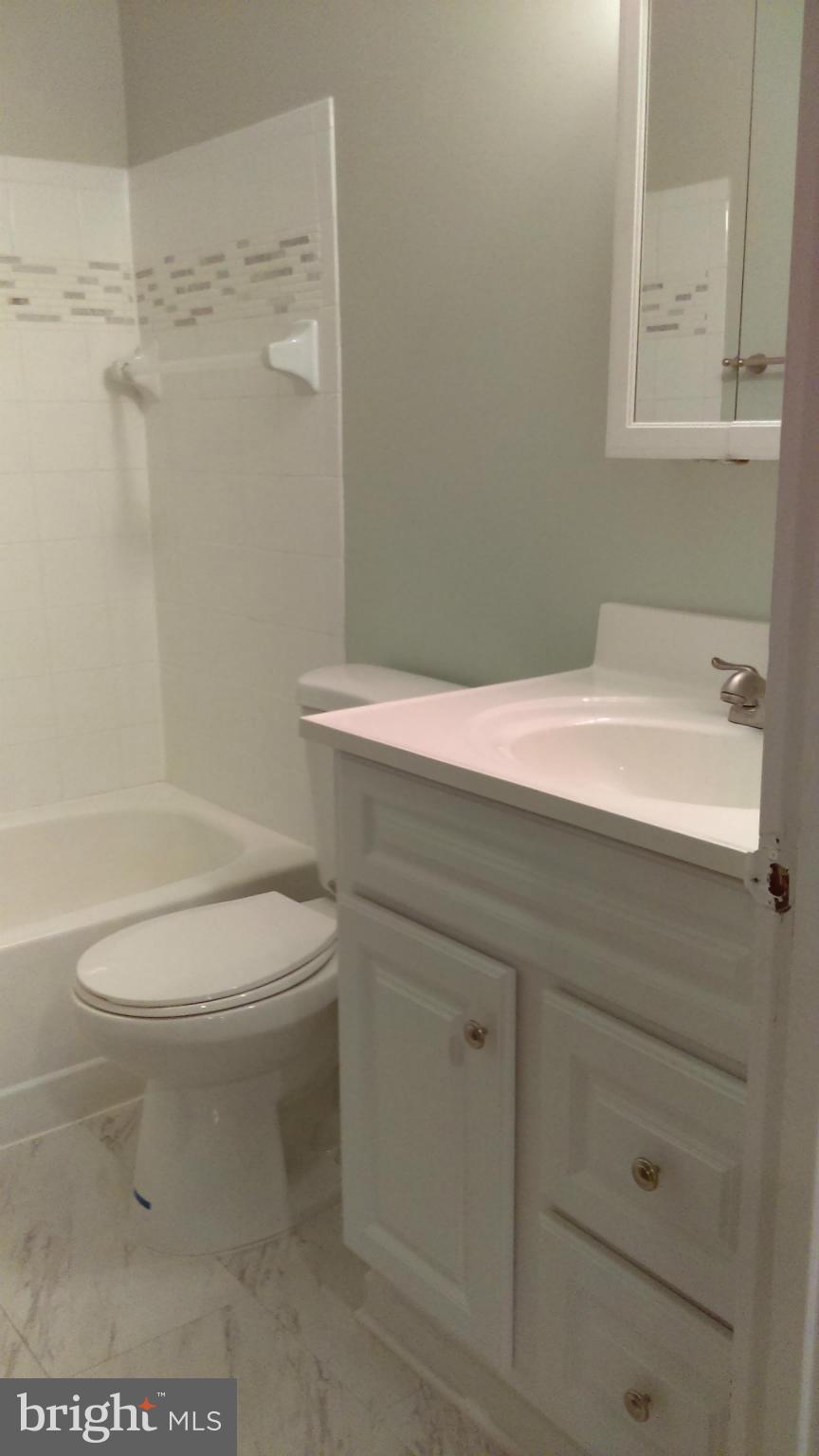 14116 Aldora Circle Silver Spring, MD 20904 - Photo 21 of 30 a bathroom with a sink a toilet and shower