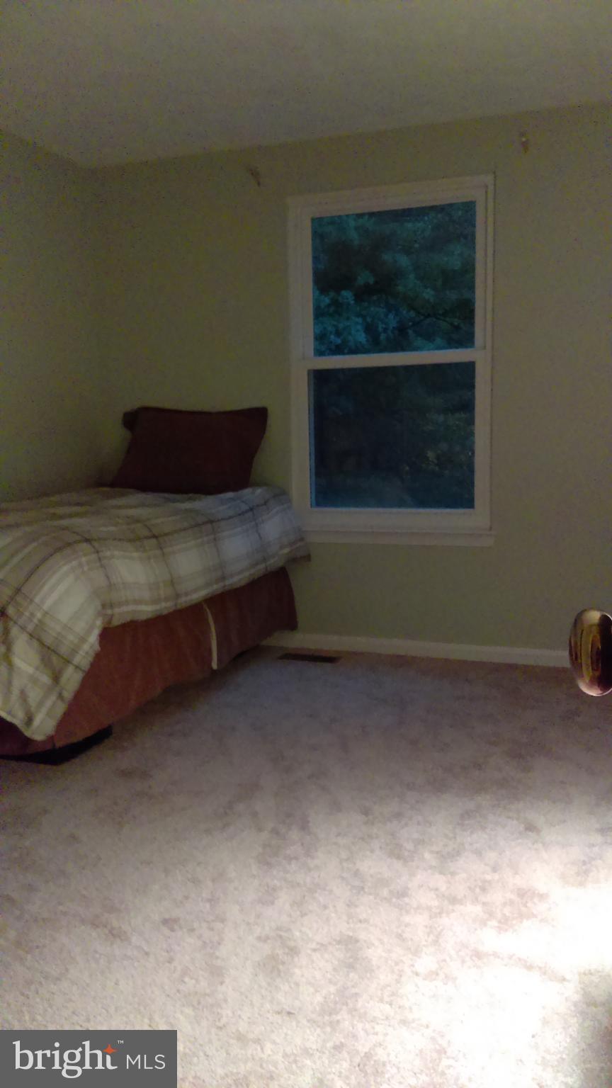 14116 Aldora Circle Silver Spring, MD 20904 - Photo 25 of 30 a room with a bed