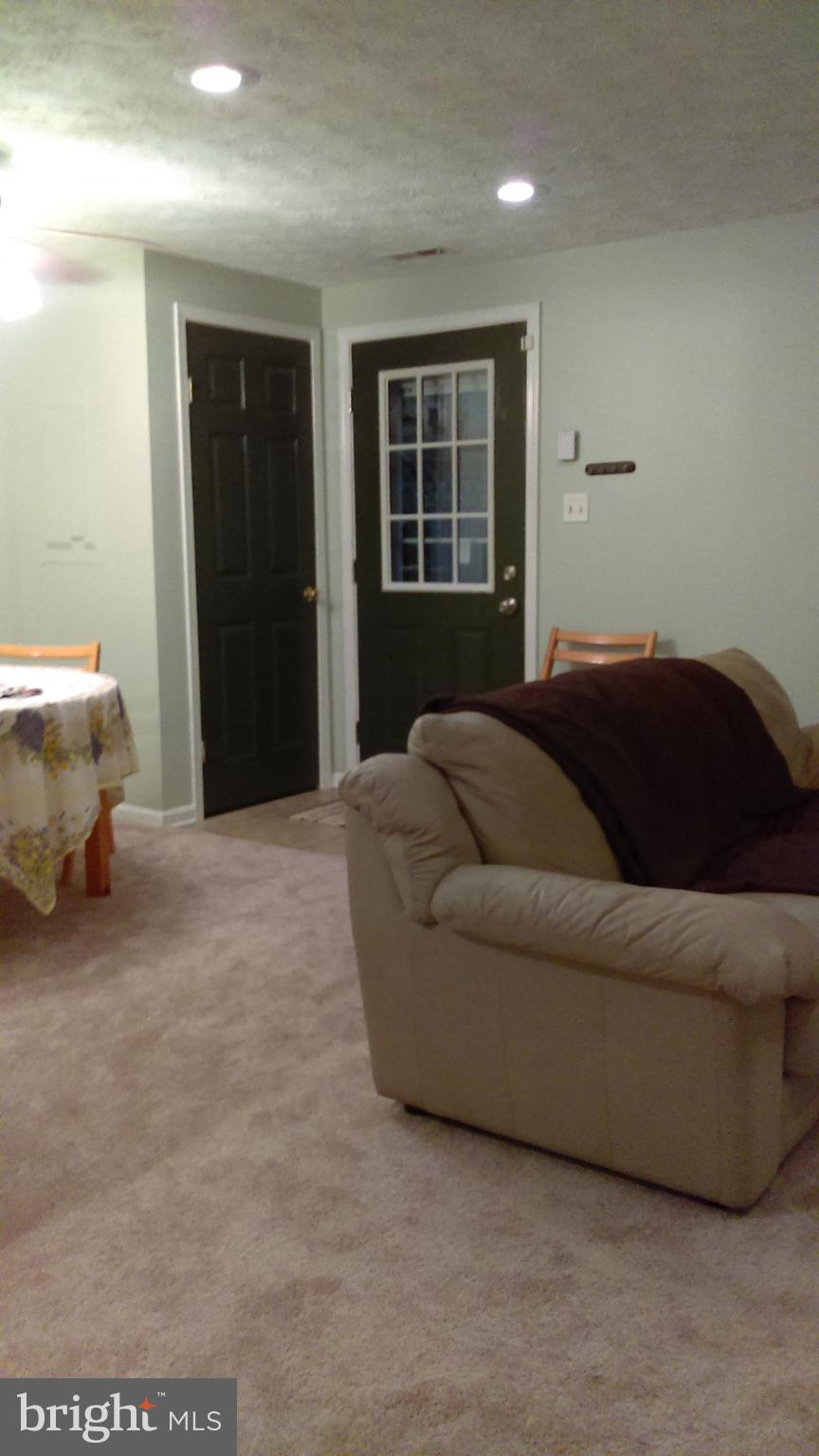 14116 Aldora Circle Silver Spring, MD 20904 - Photo 5 of 30 a living room with a couch and a window