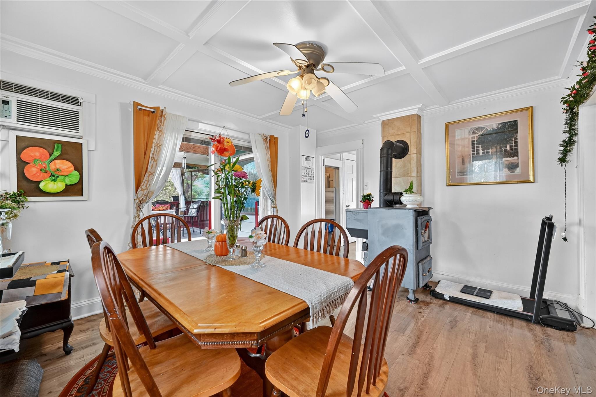 194 Old Liberty Road Monticello, NY 12701 - Photo 11 of 33 a dining room with furniture potted plants and wooden floor