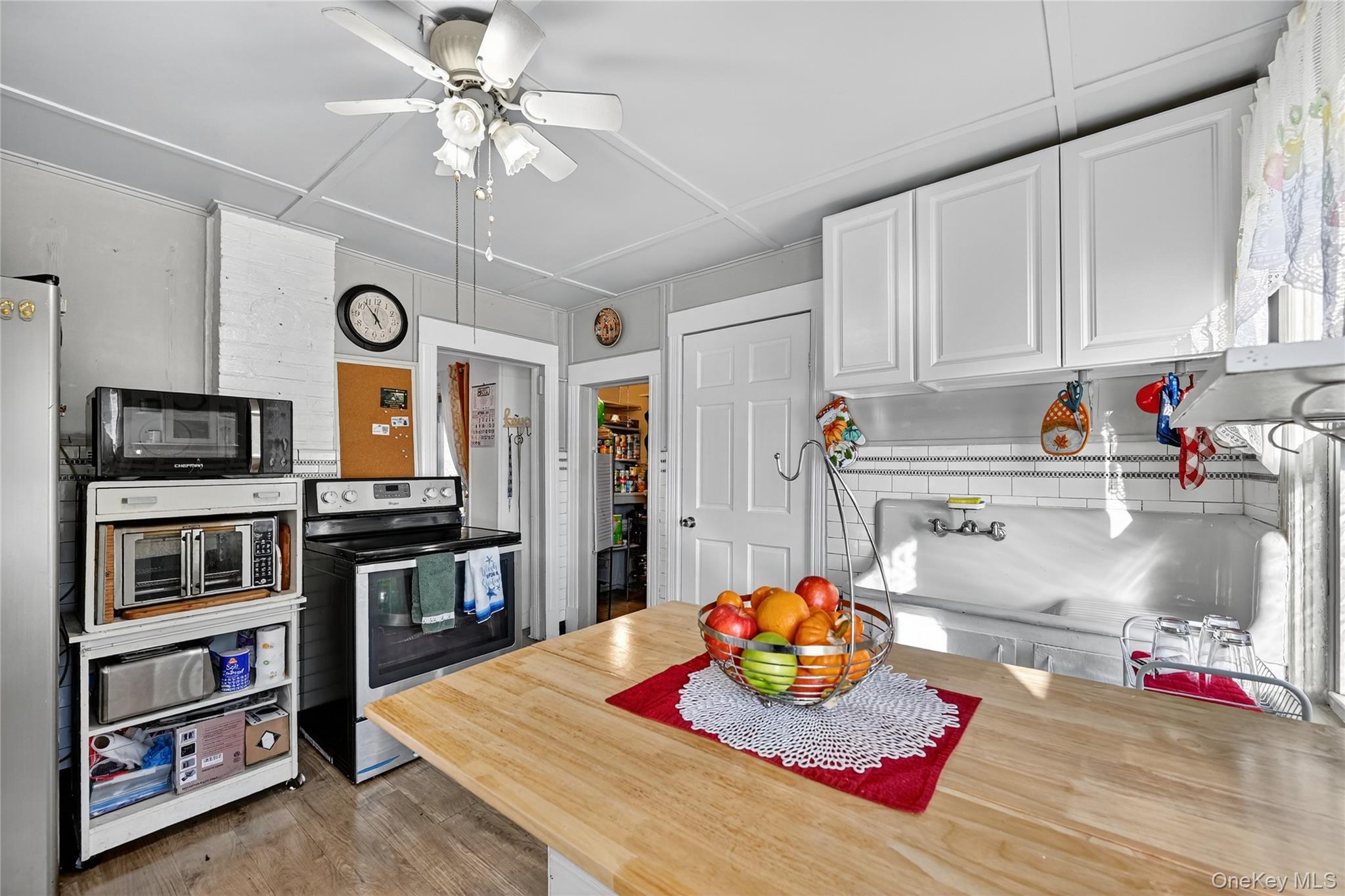 194 Old Liberty Road Monticello, NY 12701 - Photo 14 of 33 a kitchen with stainless steel appliances granite countertop a sink and cabinets