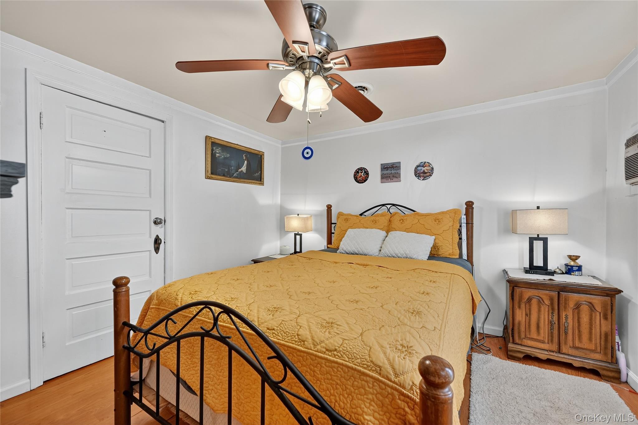 194 Old Liberty Road Monticello, NY 12701 - Photo 19 of 33 a bedroom with a bed and a chandelier