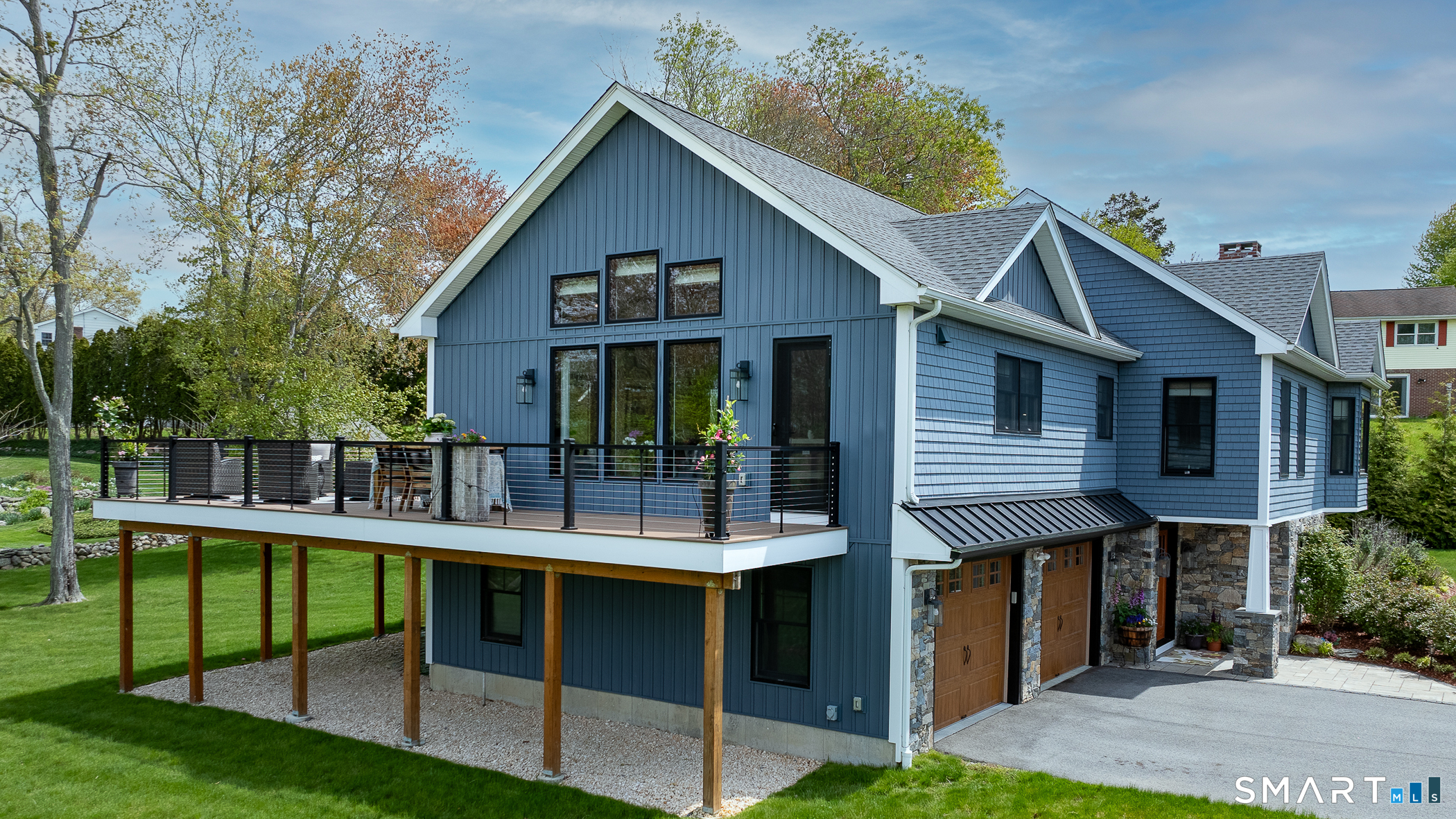 8 East Wharf Road Waterford, CT 06385 - Photo 2 of 40 a view of a house with wooden deck and furniture