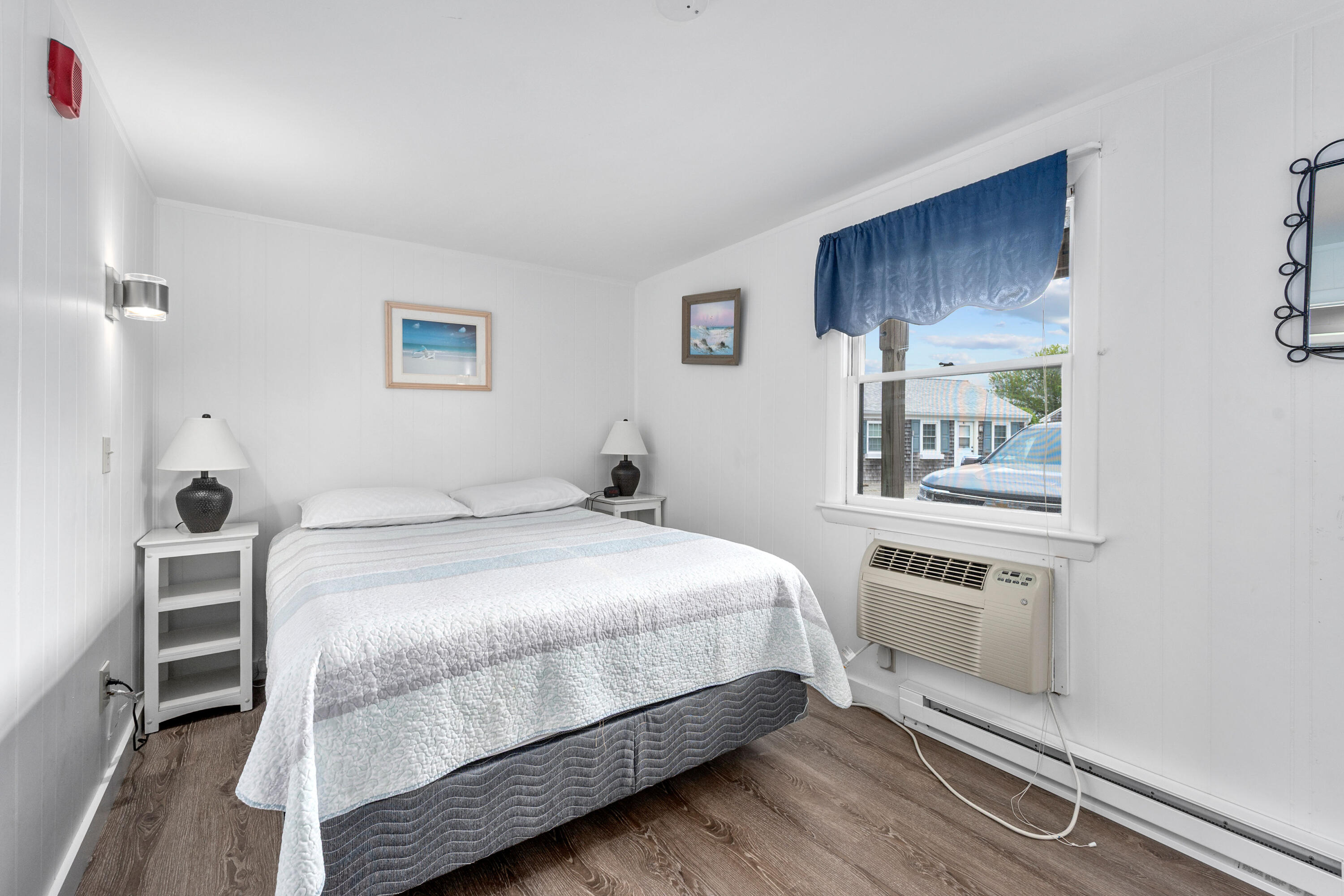 154 Old Wharf Road, Unit 26 Dennis Port, MA 02639 - Photo 5 of 6 a bedroom with a bed and a window