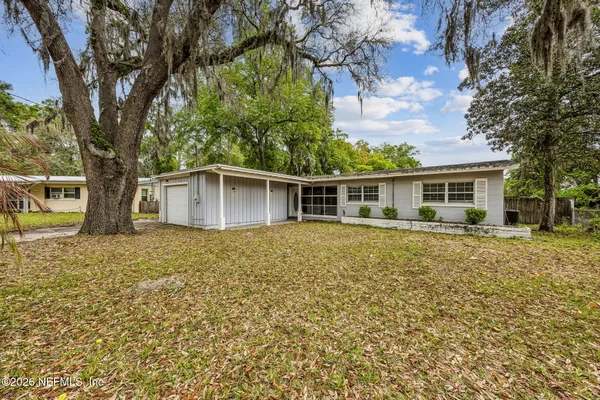 front view of house with a trees