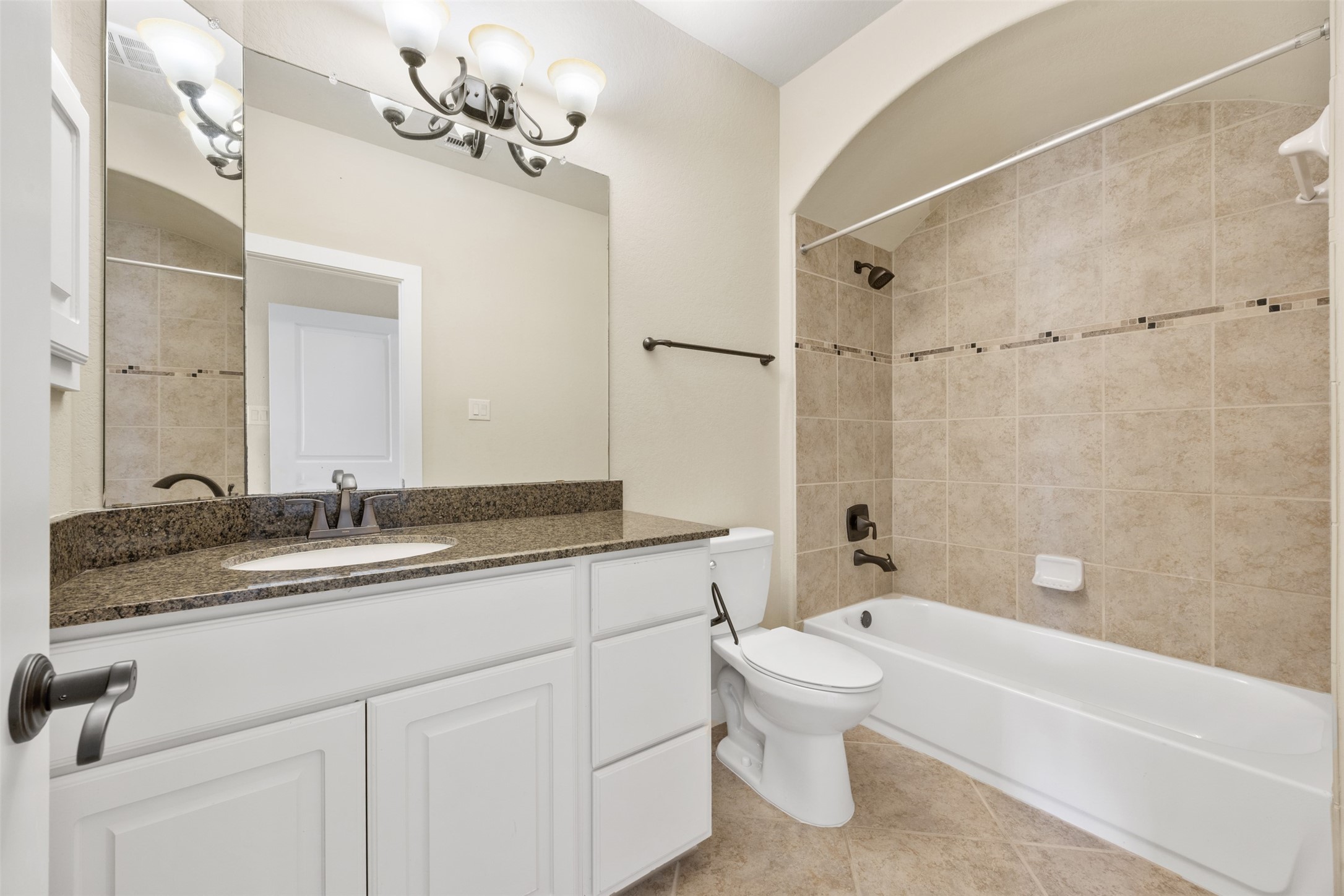 6515 Fraser Point Spring, TX 77379 - Photo 21 of 39 a bathroom with a granite countertop sink a toilet and bathtub