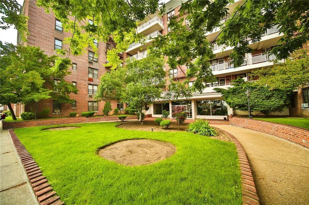 3235 Emmons Avenue, Unit 516 Brooklyn, NY 11235 - Photo 1 of 3 a view of a swimming pool with a garden