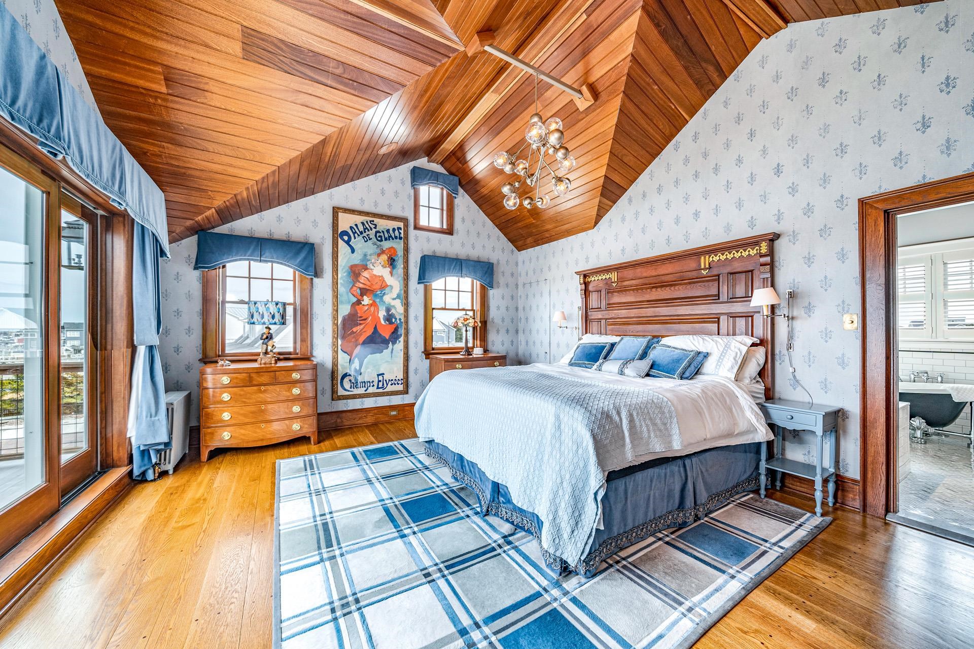 612 South Bayview Strathmere, NJ 08248 - Photo 11 of 38 a bedroom with a bed and wooden floor