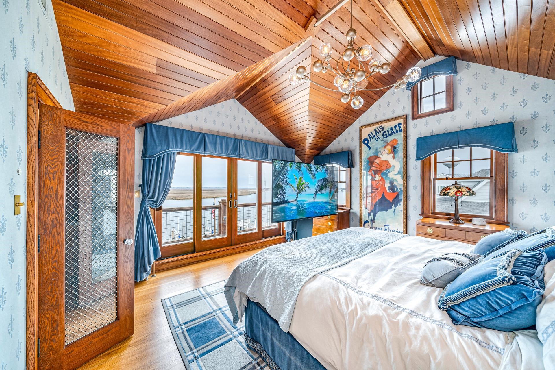 612 South Bayview Strathmere, NJ 08248 - Photo 12 of 38 a bedroom with a bed and a large window