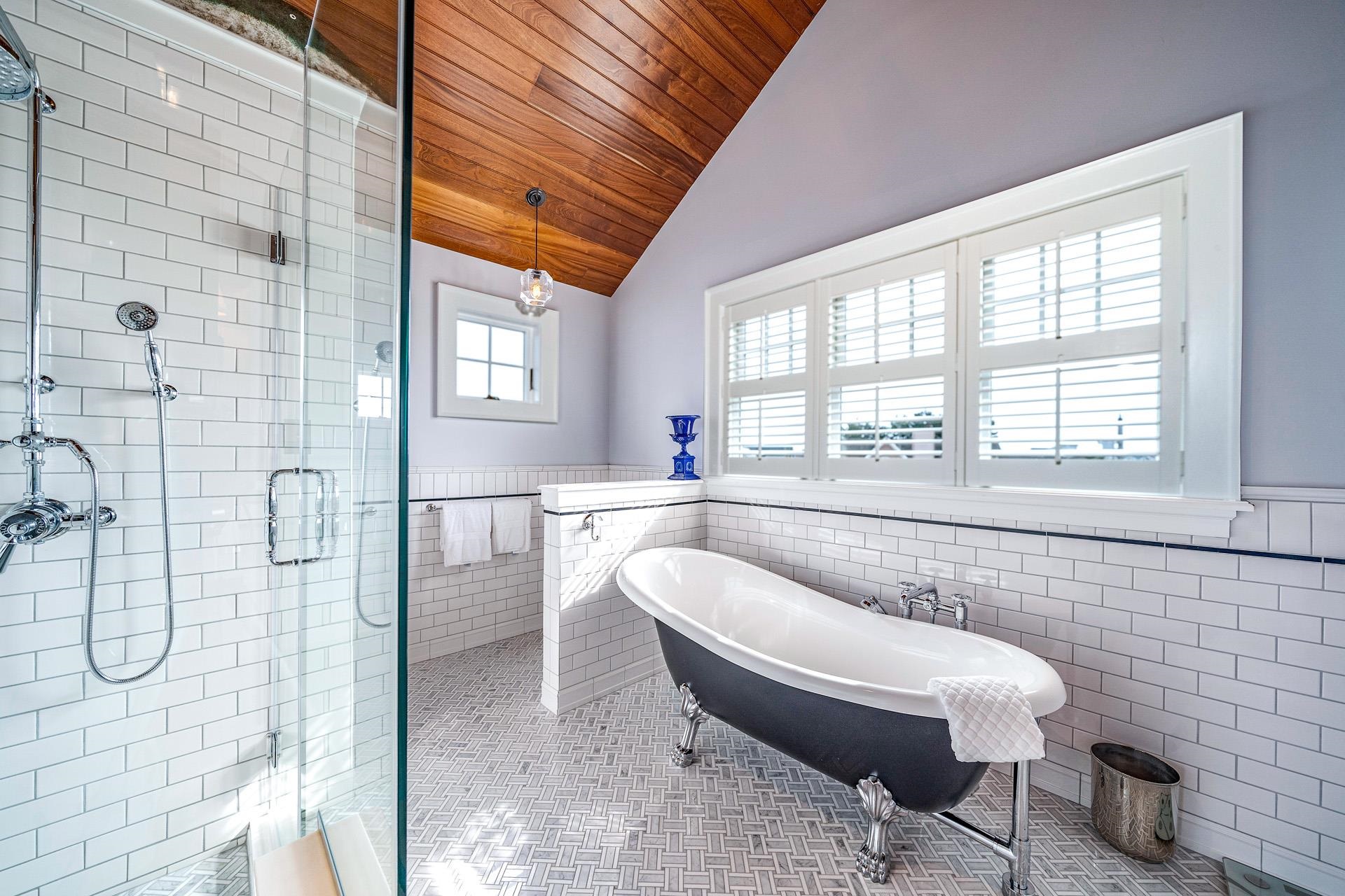 612 South Bayview Strathmere, NJ 08248 - Photo 13 of 38 a bathroom with a granite countertop sink a mirror and a shower