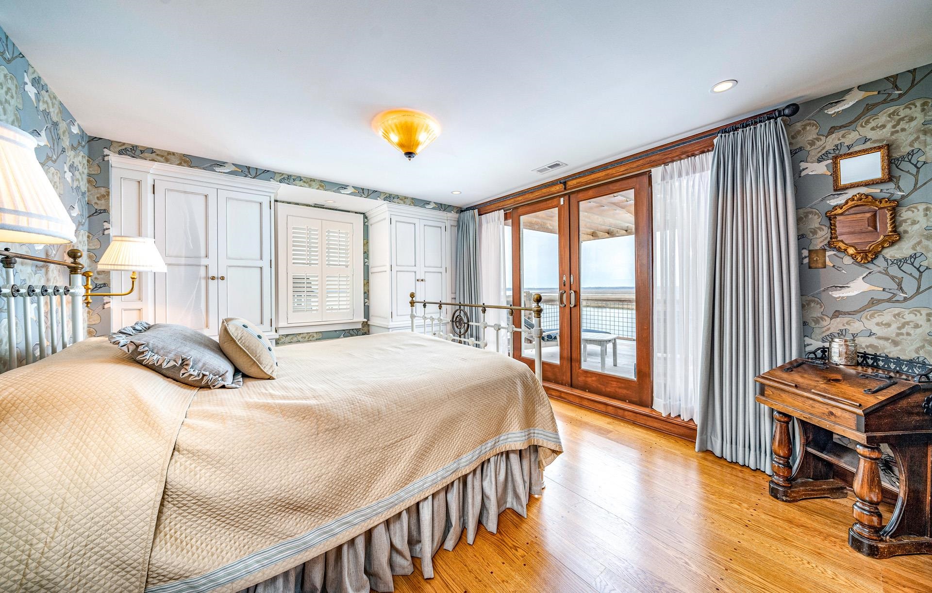 612 South Bayview Strathmere, NJ 08248 - Photo 15 of 38 a bedroom with a bed and wooden floor