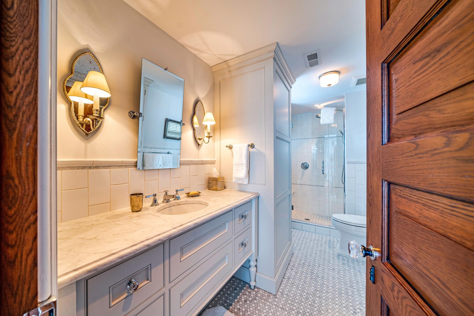 612 South Bayview Strathmere, NJ 08248 - Photo 16 of 38 a spacious bathroom with a granite countertop sink mirror and a shower