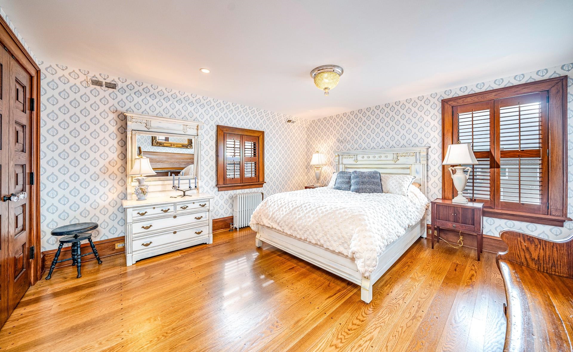 612 South Bayview Strathmere, NJ 08248 - Photo 17 of 38 a spacious bedroom with a bed and wooden floor