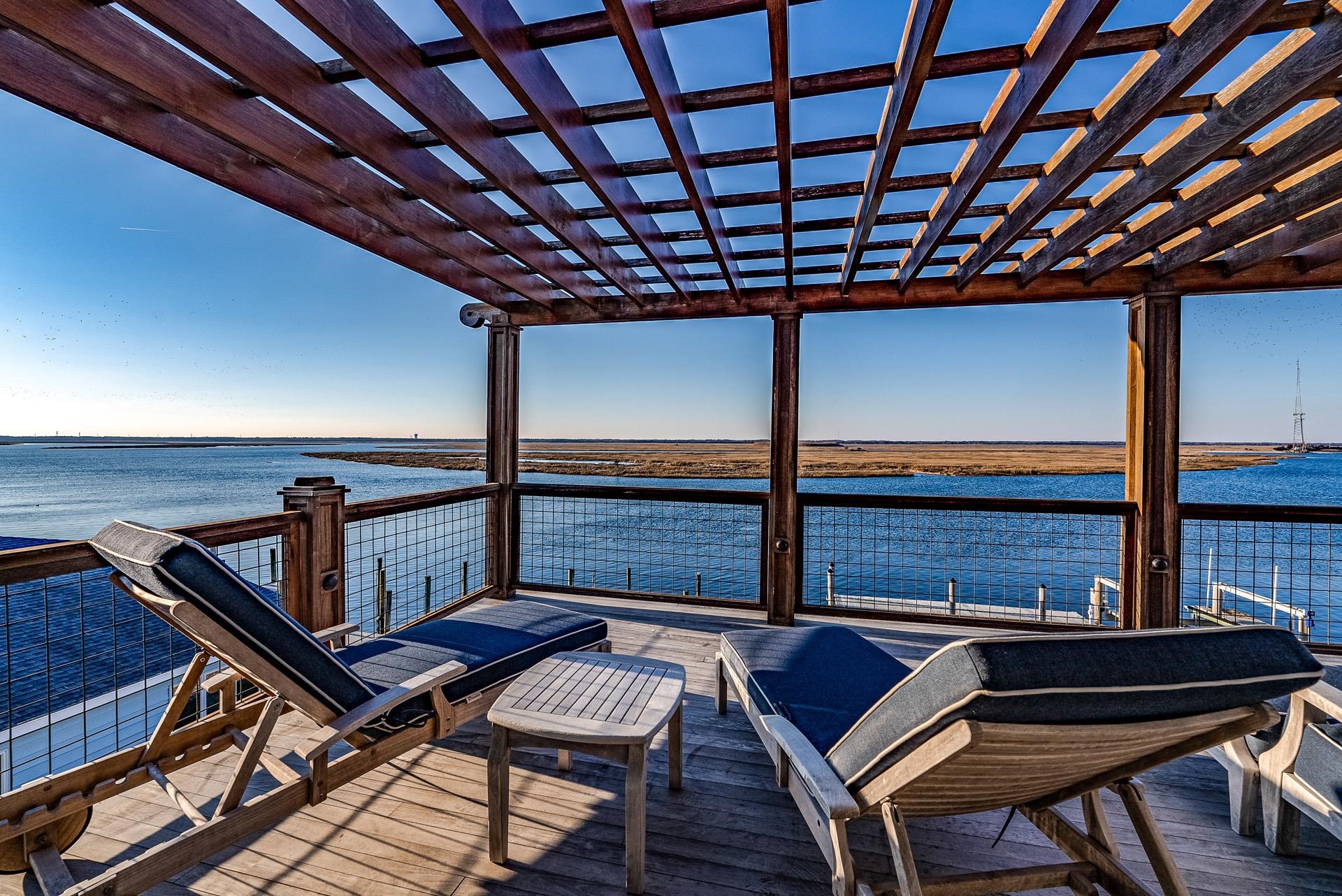 612 South Bayview Strathmere, NJ 08248 - Photo 25 of 38 a living room with furniture a window and a flat screen tv