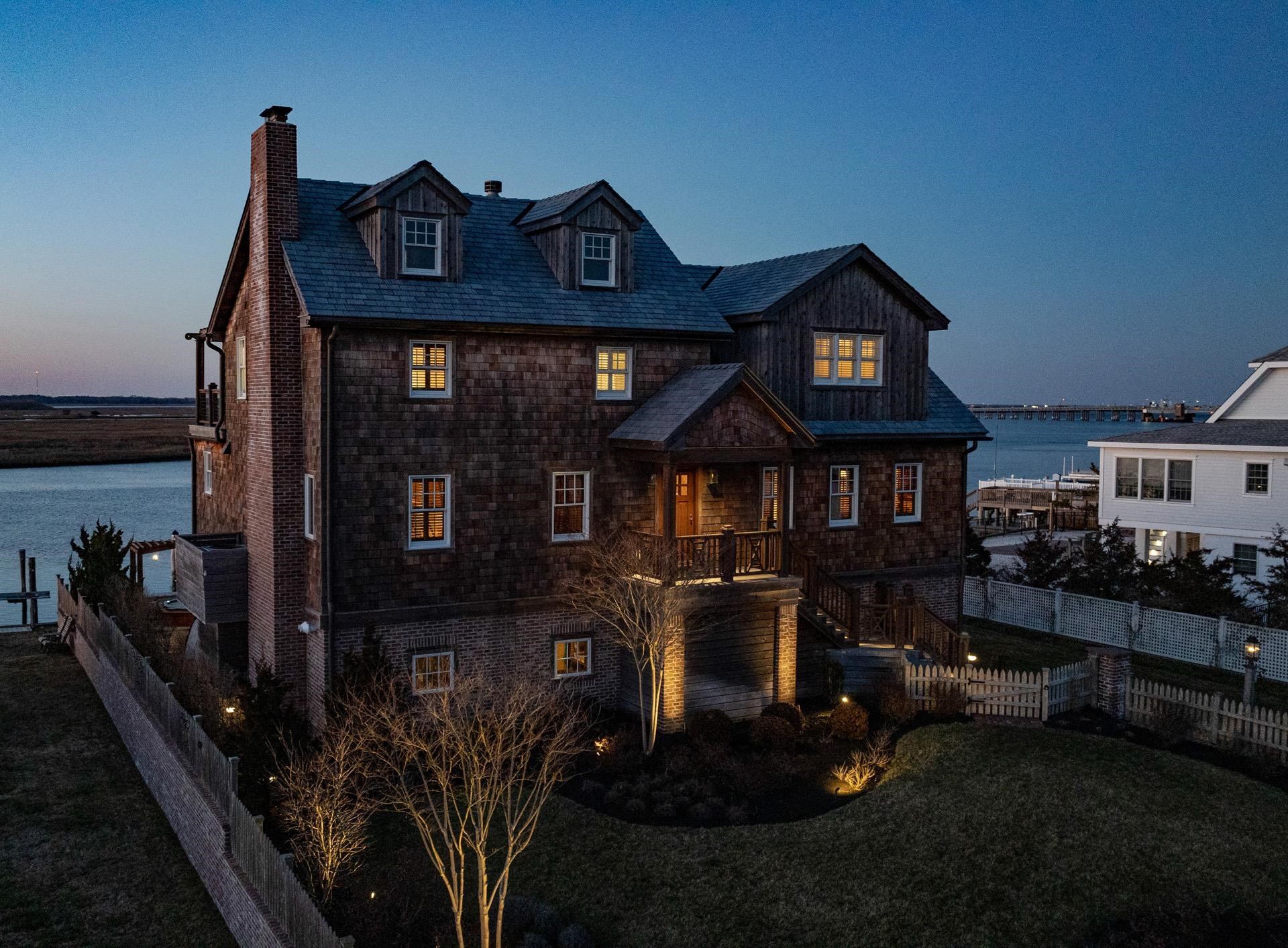 612 South Bayview Strathmere, NJ 08248 - Photo 35 of 38 a front view of a house with yard and parking space