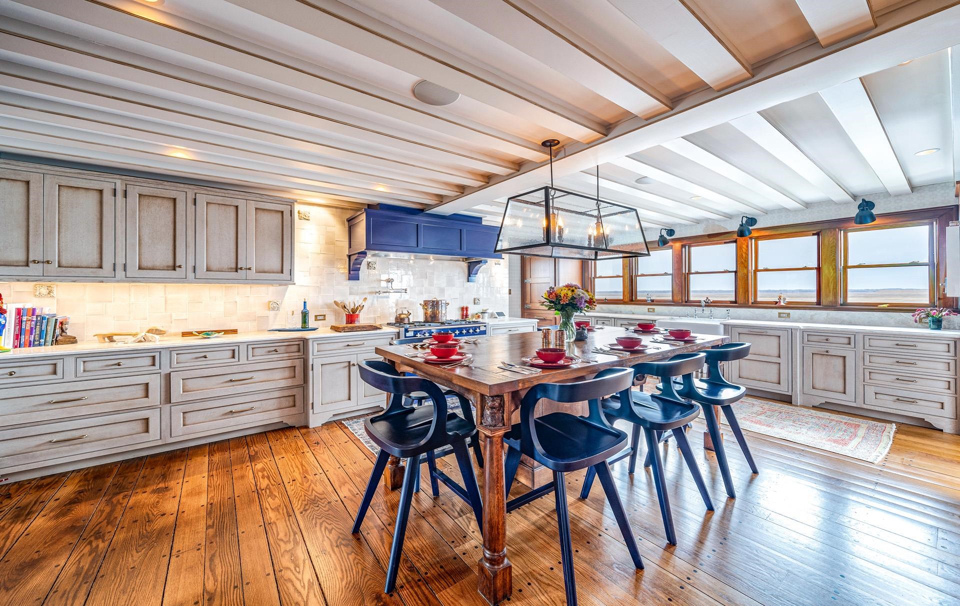 612 South Bayview Strathmere, NJ 08248 - Photo 5 of 38 a kitchen with a table chairs and a stove