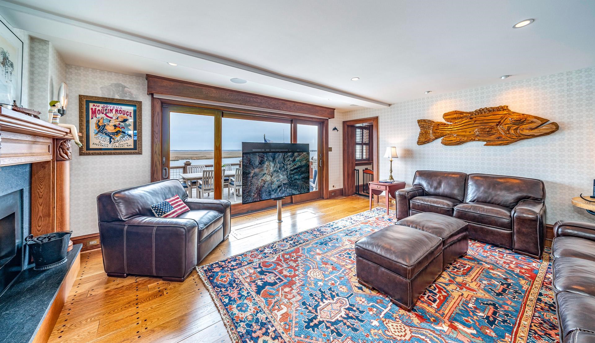 612 South Bayview Strathmere, NJ 08248 - Photo 9 of 38 a living room with furniture and a fireplace