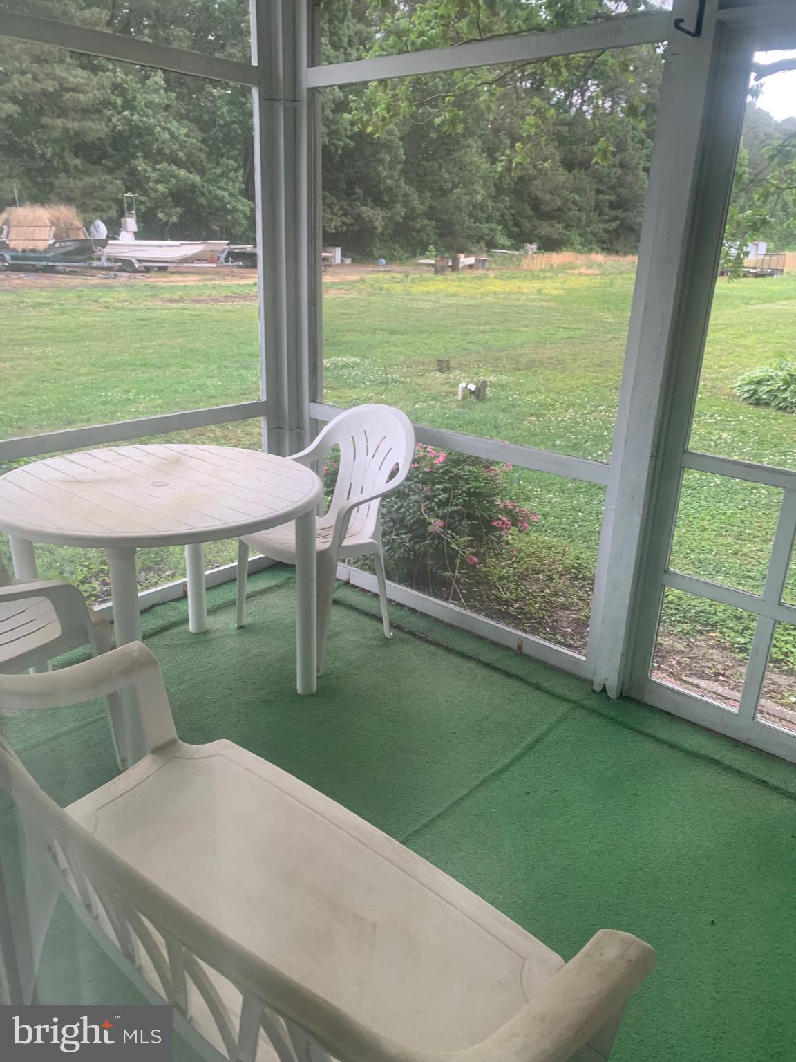 1007 Hudson Road Cambridge, MD 21613 - Photo 8 of 16 Serene screened porch with lush views.