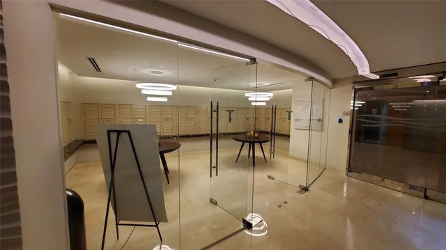 a view of an empty room with a fireplace