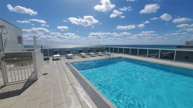 a view of swimming pool from a balcony