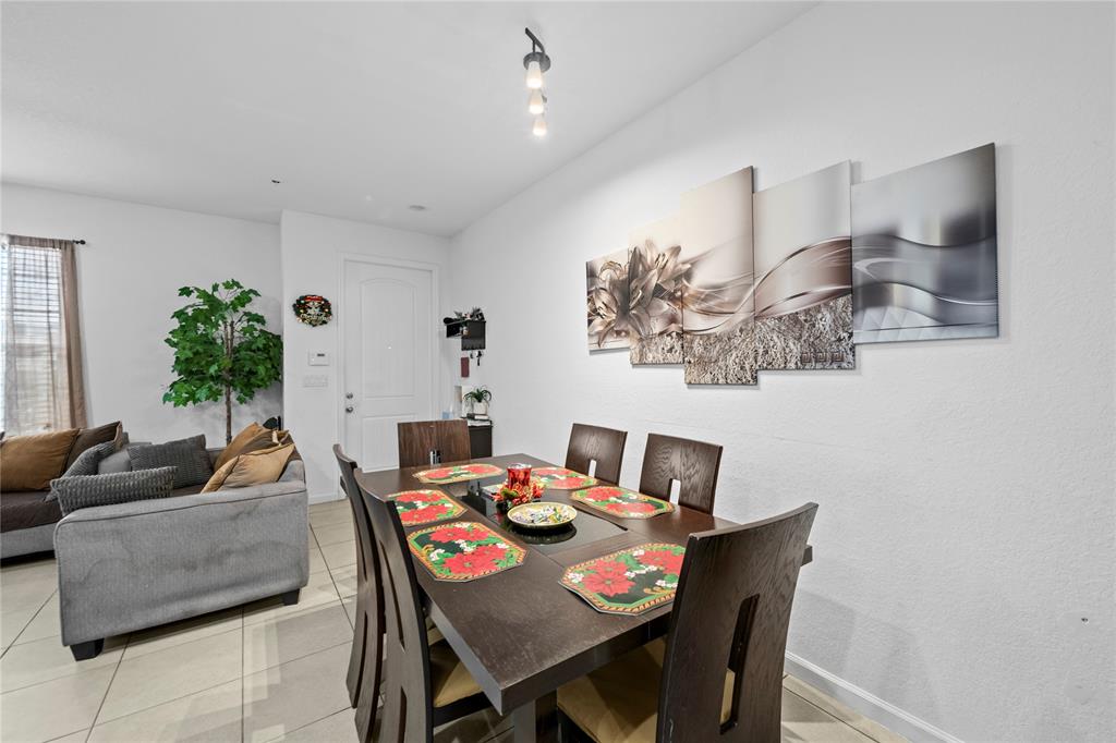 197 Southwest 6th Place, Unit 197 Pompano Beach, FL 33060 - Photo 13 of 25 a living room with furniture and wooden floor