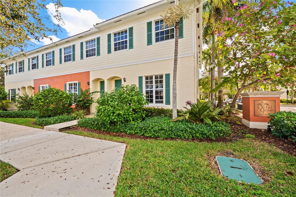 197 Southwest 6th Place, Unit 197 Pompano Beach, FL 33060 - Photo 2 of 25 a front view of a house with a yard