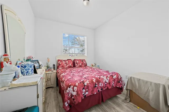 a bedroom with a bed and a dresser