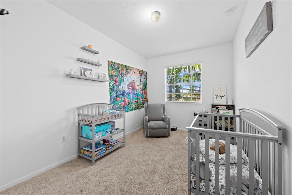 197 Southwest 6th Place, Unit 197 Pompano Beach, FL 33060 - Photo 23 of 25 a living room with furniture and a window