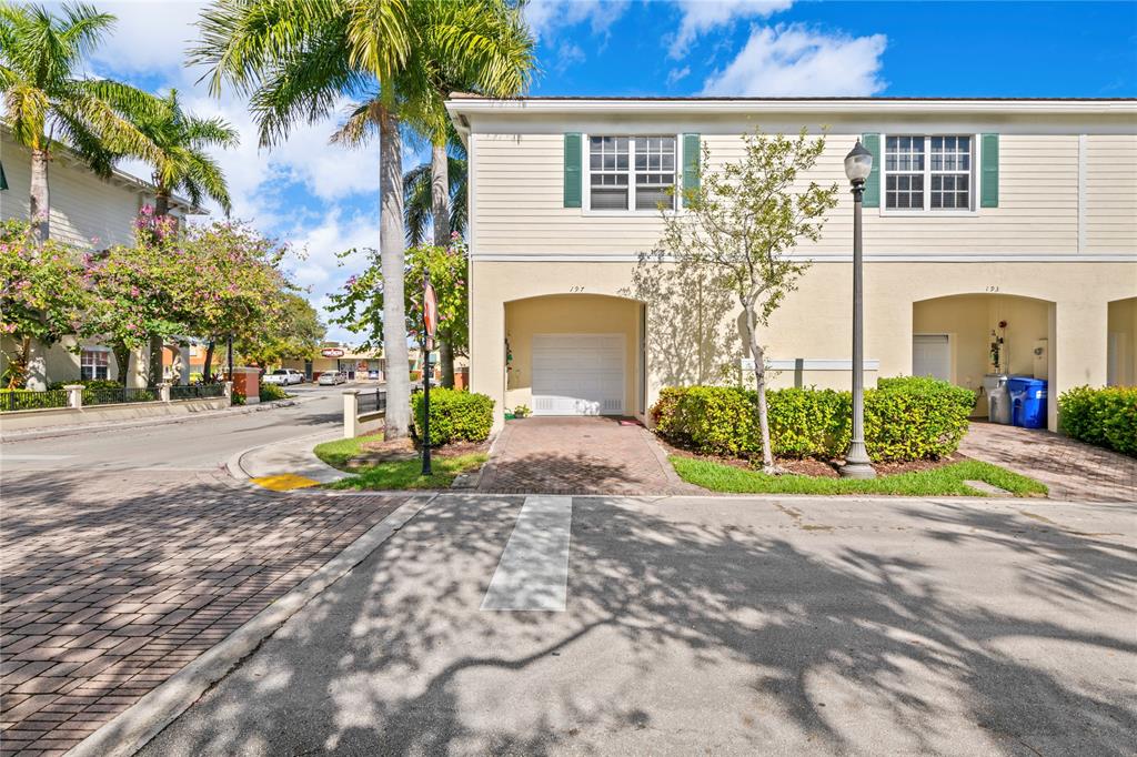 197 Southwest 6th Place, Unit 197 Pompano Beach, FL 33060 - Photo 5 of 25 a view of a house with outdoor space and a street