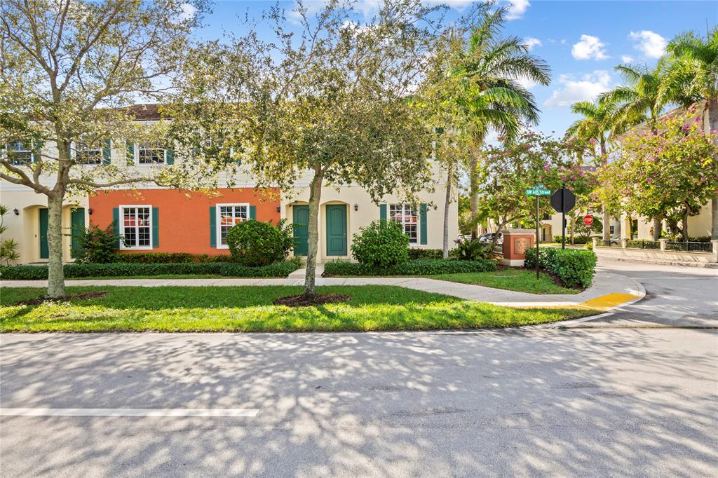 197 Southwest 6th Place, Unit 197 Pompano Beach, FL 33060 - Photo 6 of 25 a view of street with large trees