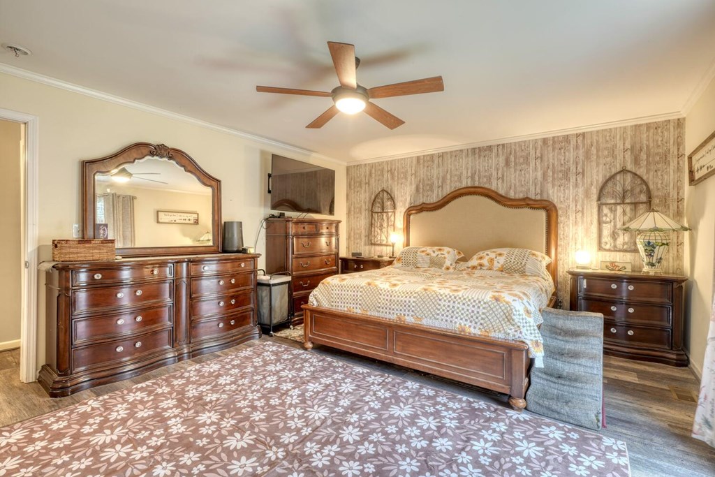 109 Hefner Road Blairsville, GA 30512 - Photo 18 of 48 a bedroom with a large bed and wooden floor