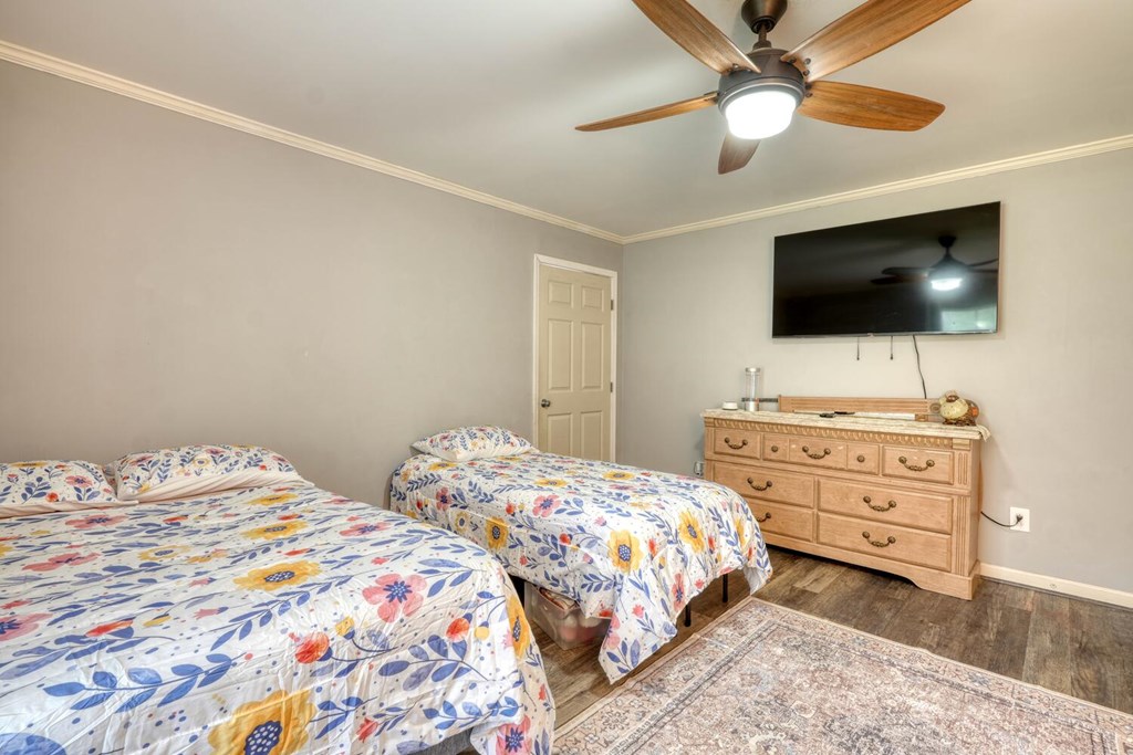 109 Hefner Road Blairsville, GA 30512 - Photo 28 of 48 a bedroom with a bed and a flat screen tv