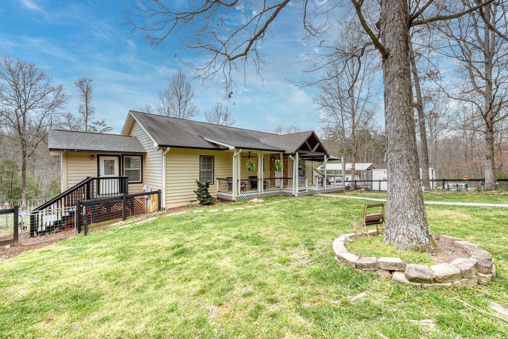 109 Hefner Road Blairsville, GA 30512 - Photo 35 of 48 a front view of a house with a yard table and chairs