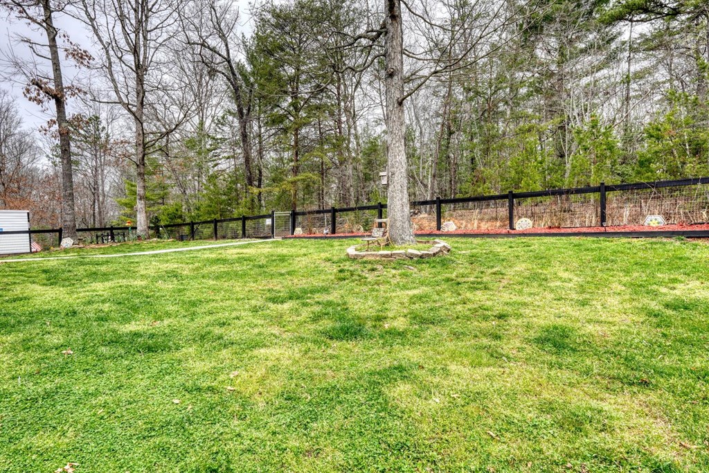 109 Hefner Road Blairsville, GA 30512 - Photo 44 of 48 a swimming pool with an outdoor space and seating area