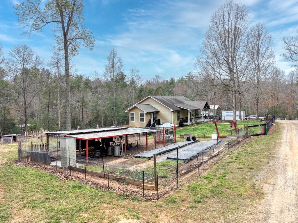 109 Hefner Road Blairsville, GA 30512 - Photo 45 of 48 a view of a house with pool and chairs